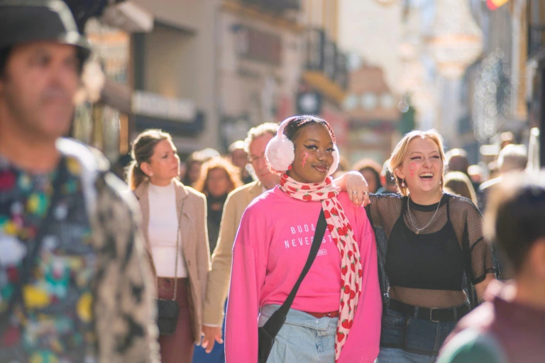 Students walking on the street in Seville.