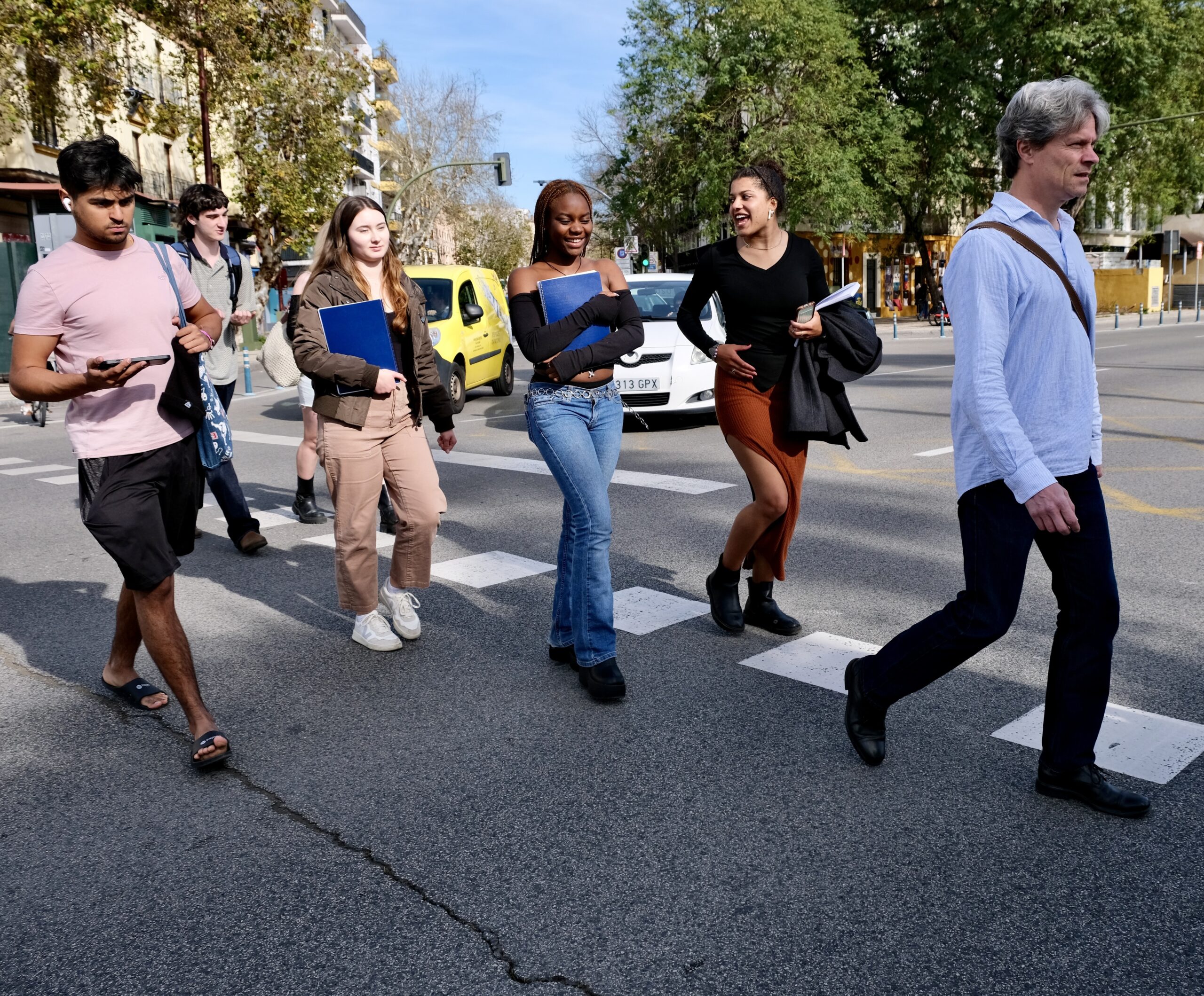 Prof. in Spain walking with students.