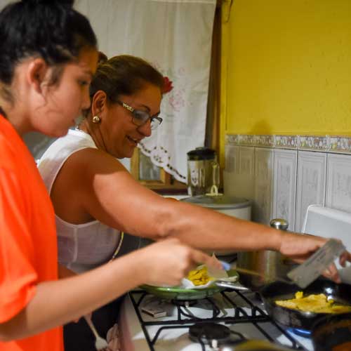Student cooking with homestay family