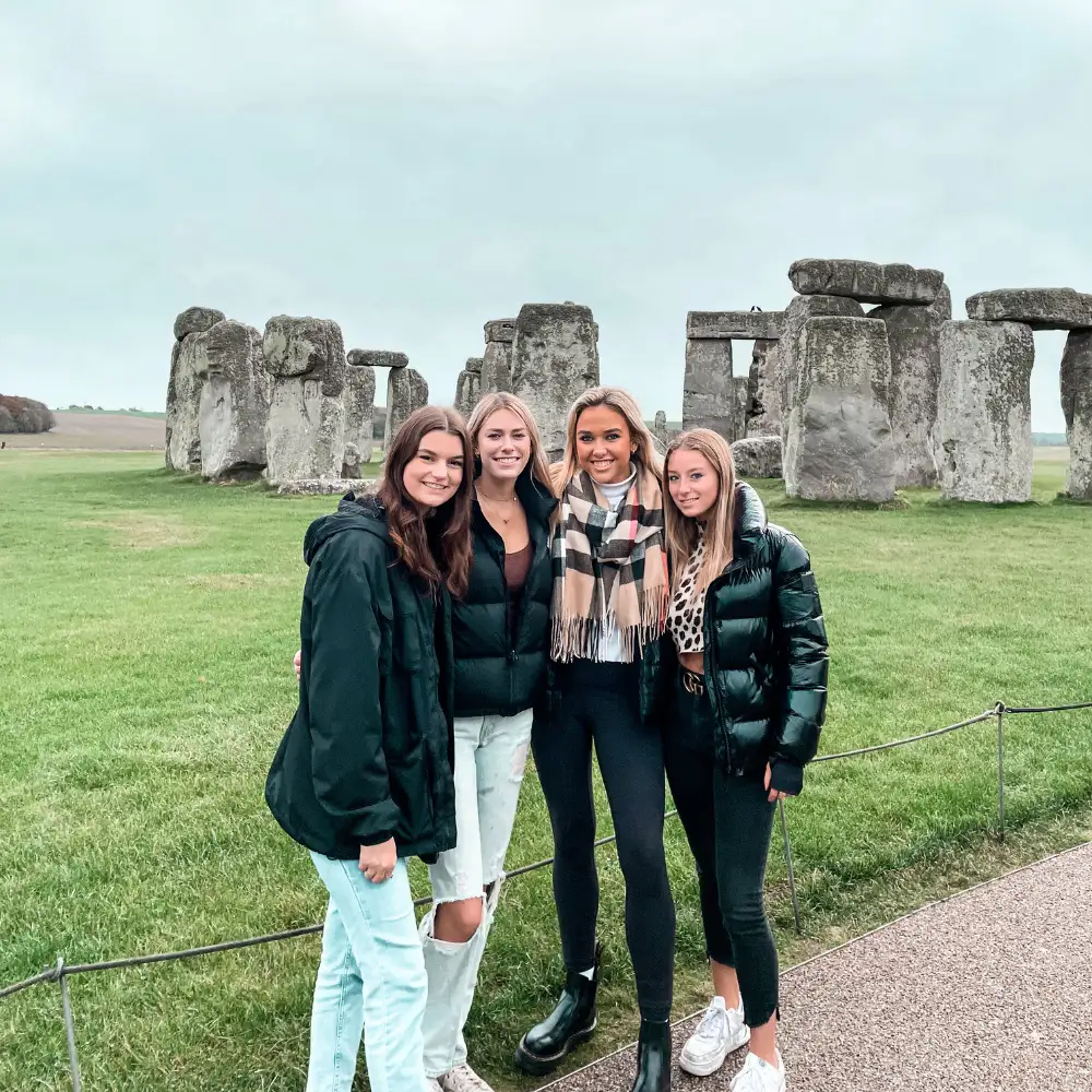 Verto students posing in front of Stonehenge in England
