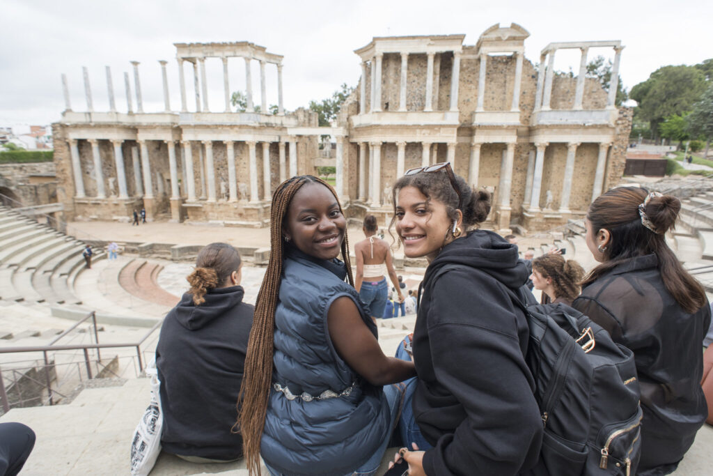 Students visiting ancient Roman ruins. 