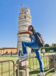 Student "hugs" the leaning Tower of Pisa.