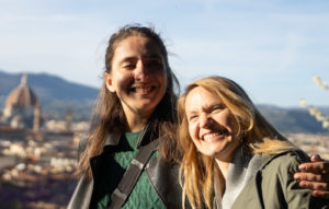 Two students pose with a sweeping view of Florence behind them during their study abroad in Italy.
