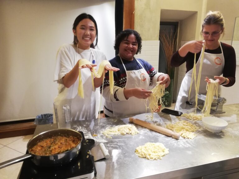 Verto Florence students making pasta by hand.