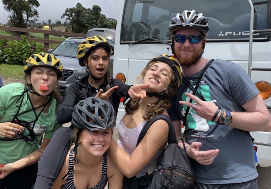 Students in bike helmets make silly faces and pose together