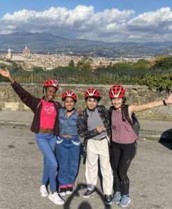 Students bike through the hills of Tuscany during their study abroad in Italy.