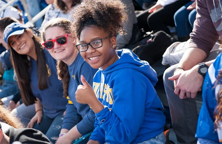 Verto student with glasses giving a thumbs up