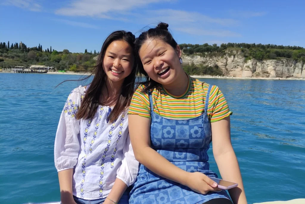 2 students on a boat in Lake Garda. 