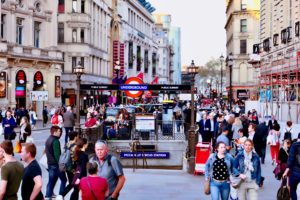Photo of people exiting at the Picadilly Circus tube station-- a classic location for students studying abroad in London to get acquainted with the city!