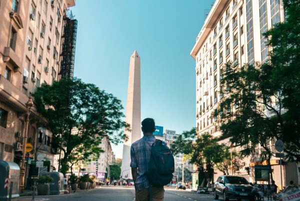 Person walking in Buenos Aires with buildings in the background