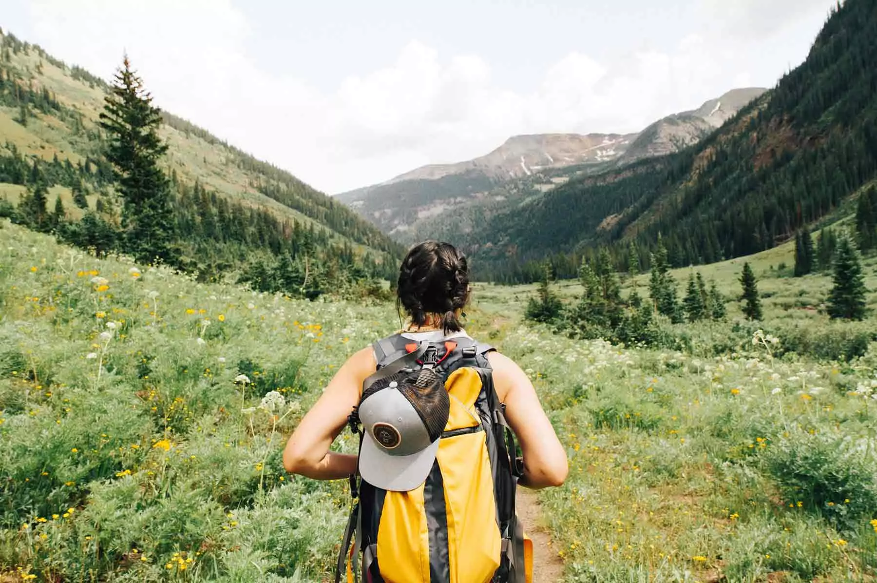 Photo: Person hiking mountain valley trail