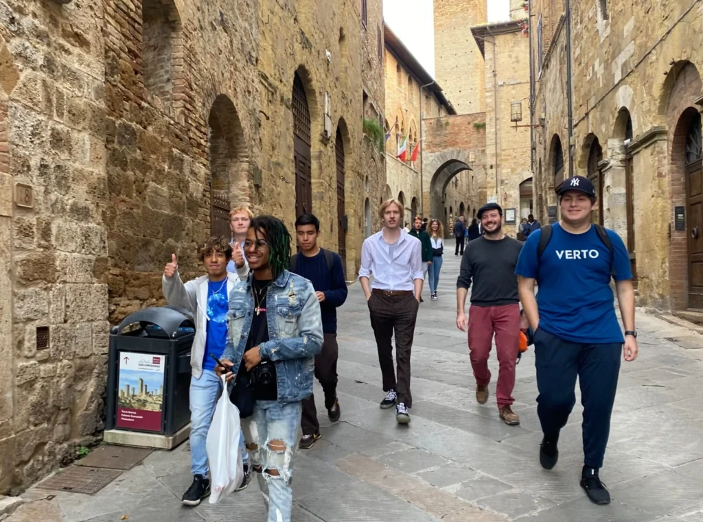 Students walking down a historic street. 