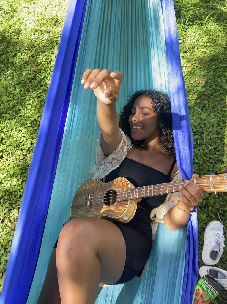 Student hanging out in a hammock