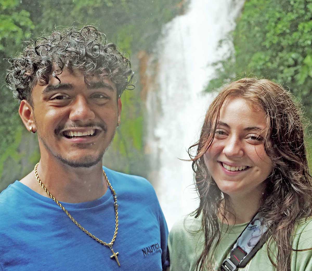 Photo: Two Verto Education students posing at waterfall