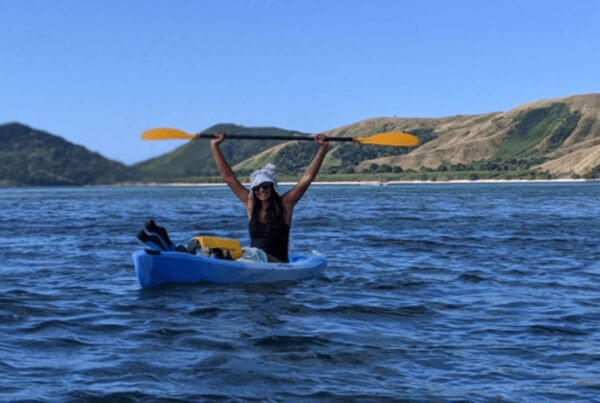 Photo: Verto Education student celebrating while sea kayaking